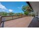 Exterior view of the home, showcasing a large wooden deck and waterfront at 6108 Oak Ridge Ave, New Port Richey, FL 34653