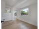 Bright laundry room with large windows, tile backsplash, and ample space at 6108 Oak Ridge Ave, New Port Richey, FL 34653