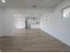 Open-concept living space with sleek modern flooring and ample natural light at 6108 Oak Ridge Ave, New Port Richey, FL 34653