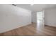 Living room featuring light hardwood floors, with white walls at 6108 Oak Ridge Ave, New Port Richey, FL 34653