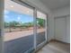 Living room view to the deck and water view through a large sliding glass door at 6108 Oak Ridge Ave, New Port Richey, FL 34653