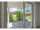 Covered patio features tile flooring and an open view of the backyard at 6108 Oak Ridge Ave, New Port Richey, FL 34653