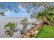 A picturesque backyard is set against the tranquil water of the bay at 6220 Bayshore Blvd, Tampa, FL 33611