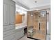 Stunning bathroom with a modern sauna, sleek vanity, and elegant chandelier lighting at 6220 Bayshore Blvd, Tampa, FL 33611