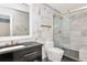 Elegant bathroom with marble tile, glass shower, and sleek black vanity at 6220 Bayshore Blvd, Tampa, FL 33611