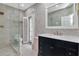Stylish bathroom with glass shower, patterned tile, and a chic vanity at 6220 Bayshore Blvd, Tampa, FL 33611