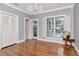 Bright bedroom with hardwood floors, natural light, and a classic chandelier at 6220 Bayshore Blvd, Tampa, FL 33611