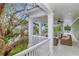 Inviting covered patio with comfortable seating and a tranquil view of the surrounding foliage at 6220 Bayshore Blvd, Tampa, FL 33611