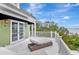 Expansive deck with french doors, perfect for relaxing and enjoying the scenic waterfront views at 6220 Bayshore Blvd, Tampa, FL 33611