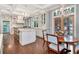Charming dining area showcasing a beautiful display cabinet and hardwood floors at 6220 Bayshore Blvd, Tampa, FL 33611