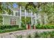 Charming two-story home with a double porch, landscaped yard and mature trees in a desirable location at 6220 Bayshore Blvd, Tampa, FL 33611