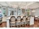 Elegant kitchen featuring a large island, stylish seating, hardwood floors, and windows at 6220 Bayshore Blvd, Tampa, FL 33611