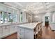 Elegant kitchen with marble countertops, a large island, pendant lighting, and hardwood floors at 6220 Bayshore Blvd, Tampa, FL 33611