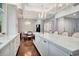 Open-concept kitchen with a large island, a dining area, and hardwood floors at 6220 Bayshore Blvd, Tampa, FL 33611