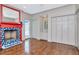 A living room with a fireplace, doors to the outside, wood floors and closet space at 6220 Bayshore Blvd, Tampa, FL 33611