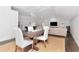 Bright living room featuring a dining table, pool table, and comfortable sofa at 6220 Bayshore Blvd, Tampa, FL 33611