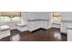 Charming sitting room featuring window seats, built-in storage and hardwood floors at 6220 Bayshore Blvd, Tampa, FL 33611
