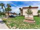 Covington Court community signage with mature landscaping and palm trees at 6360 1St N St # 202, St Petersburg, FL 33702