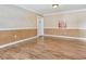 Cozy living room featuring hardwood floors, crown molding, and a painting at 6360 1St N St # 202, St Petersburg, FL 33702