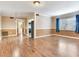 Spacious living room featuring hardwood floors, crown molding, and natural light at 6360 1St N St # 202, St Petersburg, FL 33702