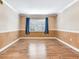 Bright living room with hardwood floors and natural light through the window at 6360 1St N St # 202, St Petersburg, FL 33702
