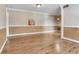 Bright living room featuring hardwood floors and decorative light fixture at 6360 1St N St # 202, St Petersburg, FL 33702