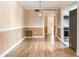 Living room featuring hardwood floors with view into the kitchen and hallway at 6360 1St N St # 202, St Petersburg, FL 33702
