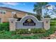 Pine Ridge community sign with well-maintained landscaping showcasing the welcoming entrance to the neighborhood at 6909 Holly Heath Dr, Riverview, FL 33578