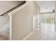 Bright entryway with tile flooring leading to living area with large sliding glass doors at 6909 Holly Heath Dr, Riverview, FL 33578