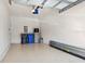 Spacious garage providing ample room for parking and storage, with visible water heater and garage door opener at 6909 Holly Heath Dr, Riverview, FL 33578