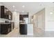 Well-lit kitchen boasts stainless steel appliances, granite countertops, and a center island at 6909 Holly Heath Dr, Riverview, FL 33578