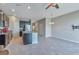 Open concept kitchen with stainless steel appliances, island with sink, and breakfast bar at 6909 Holly Heath Dr, Riverview, FL 33578