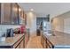 Modern kitchen with granite countertops, stainless steel appliances, and ample cabinet space at 6909 Holly Heath Dr, Riverview, FL 33578