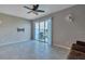 Bright living room with tile floors and sliding glass doors leading to the backyard patio at 6909 Holly Heath Dr, Riverview, FL 33578