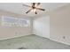 Bright bedroom with a ceiling fan, closet, and large window at 7000 Lafayette N, Pinellas Park, FL 33781