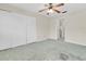 Bedroom featuring a ceiling fan, closet, and doorway to other parts of the home at 7000 Lafayette N, Pinellas Park, FL 33781