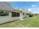 Exterior view of home with lawn and multiple windows at 7000 Lafayette N, Pinellas Park, FL 33781