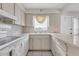 Kitchen featuring white appliances and tile countertops at 7000 Lafayette N, Pinellas Park, FL 33781