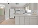 Functional kitchen with white cabinets and appliances at 7000 Lafayette N, Pinellas Park, FL 33781