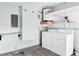 Laundry room with washer, dryer, shelving, and water heater at 7000 Lafayette N, Pinellas Park, FL 33781