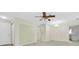Open-concept living area leading to the kitchen, with neutral walls and chandelier at 7000 Lafayette N, Pinellas Park, FL 33781