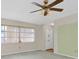 Bright living room with large window and ceiling fan at 7000 Lafayette N, Pinellas Park, FL 33781