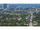 Aerial view of a neighborhood with the city and a body of water in the background at 702 W Kentucky Ave, Tampa, FL 33603