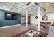 Finished basement with a home gym, living space, and painted concrete floors at 702 W Kentucky Ave, Tampa, FL 33603