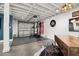 Finished basement with gym, bar, and painted concrete floors at 702 W Kentucky Ave, Tampa, FL 33603