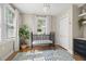 Charming Bedroom featuring natural light, hardwood floors, a crib, and coordinating decor at 702 W Kentucky Ave, Tampa, FL 33603