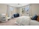 Bright bedroom featuring natural light, neutral walls, carpeted floors, and serene ambiance at 702 W Kentucky Ave, Tampa, FL 33603