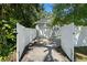 Gated driveway leading to a detached garage at 702 W Kentucky Ave, Tampa, FL 33603