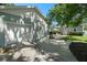 View of detached garage with extended driveway and a view of outdoor seating area at 702 W Kentucky Ave, Tampa, FL 33603