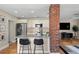 Well-equipped kitchen featuring granite counters, stainless appliances, and breakfast bar seating at 702 W Kentucky Ave, Tampa, FL 33603